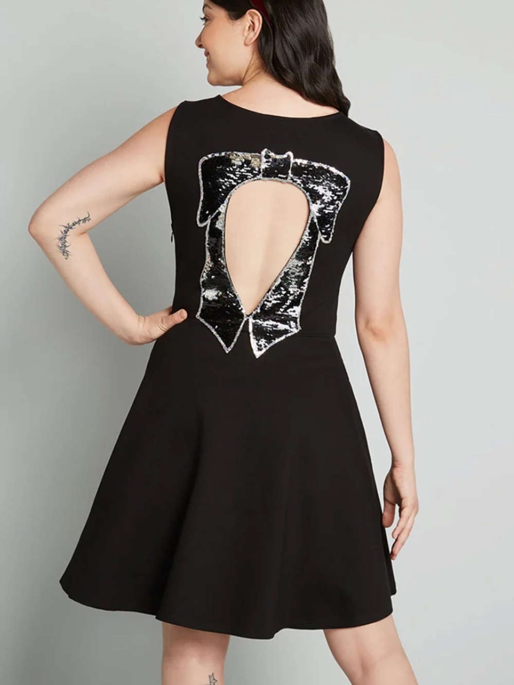 ModCloth Black Bow Affair fit and flare dress black sequined bow back cutout